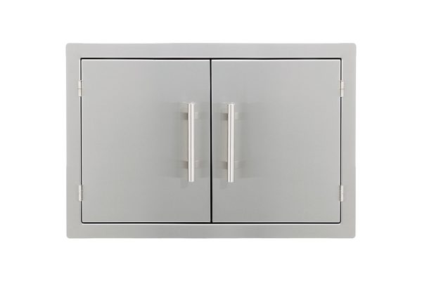 The Stainless double access door features sleek handles and a modern, minimalist design. Perfect for mounting on flat surfaces, it's ideal for outdoor kitchens or storage. Doors are closed.